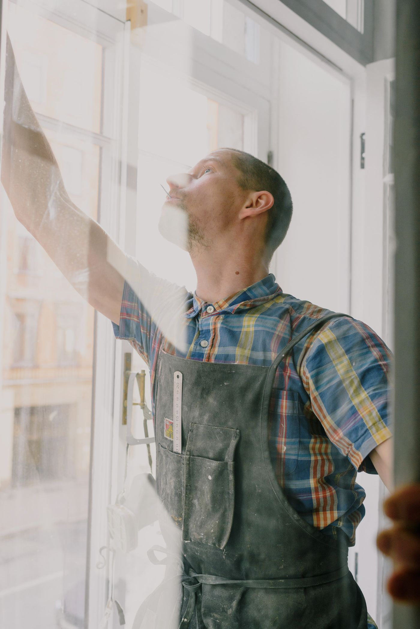 Professional installer fitting an impact window
